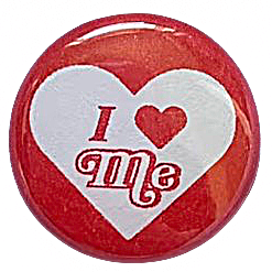 a red pin with a white heart containing red text reading 'I heart Me'