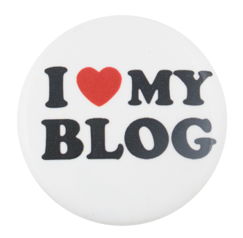 a white pin with black text that reads 'I (heart) MY BLOG'. the heart is an image of a red heart