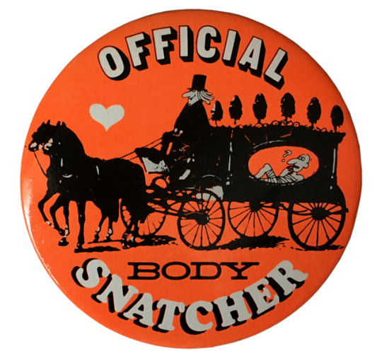 an orange pin with someone riding a horse-drawn carridge with a confused person inside, and text reading 'OFFICIAL BODYSNATCHER'